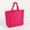 Reusable pink customizable business nonwoven clothing shopping bag